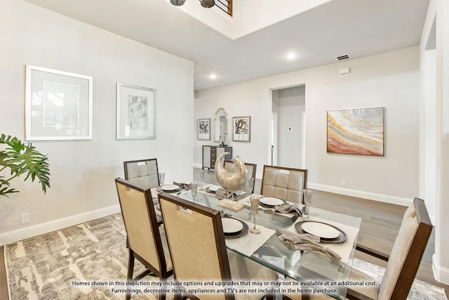 dining area with hardwood / wood-style flooring