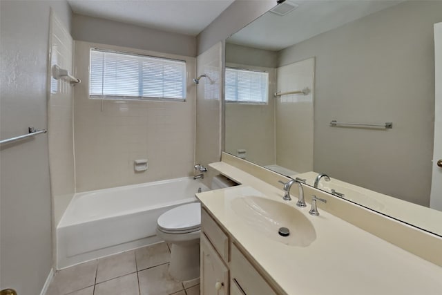 full bathroom featuring tiled shower / bath, tile patterned flooring, vanity, and toilet