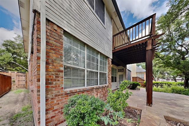 view of side of home featuring a patio area