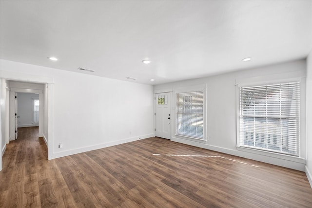 empty room featuring dark hardwood / wood-style floors