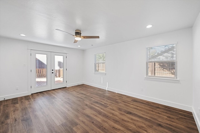 spare room featuring dark hardwood / wood-style floors, french doors, and ceiling fan