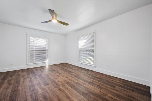 unfurnished room with dark hardwood / wood-style floors and ceiling fan