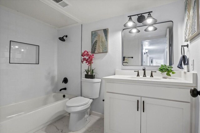 full bathroom featuring vanity, toilet, and tiled shower / bath