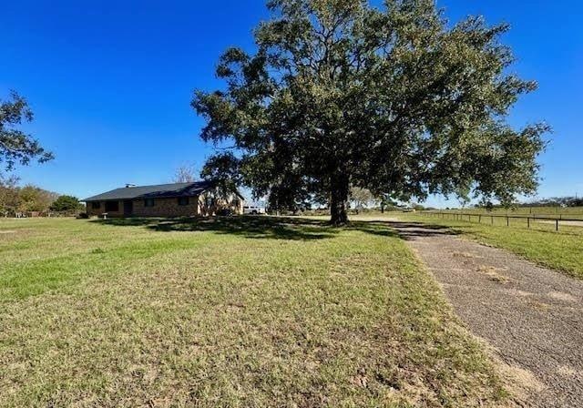 view of yard with a rural view