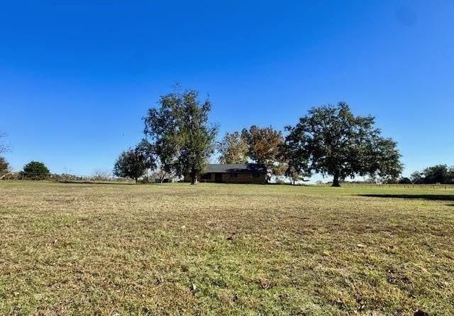 view of yard with a rural view