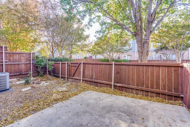 view of yard with a patio and central AC unit