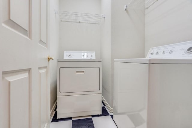 laundry room with washing machine and dryer