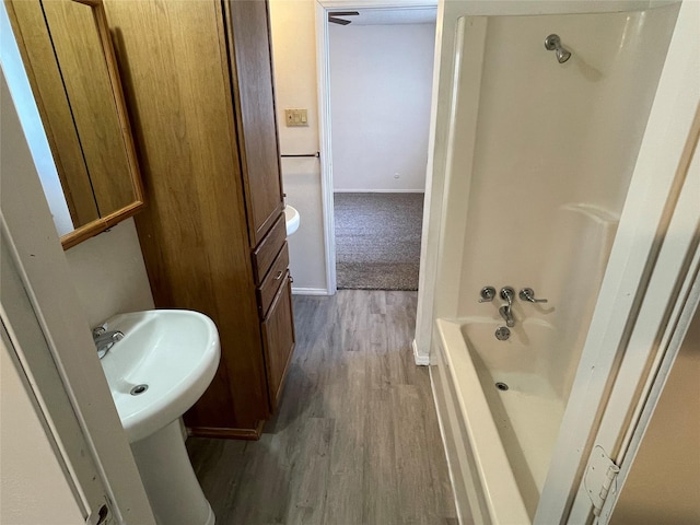 bathroom featuring baseboards and wood finished floors