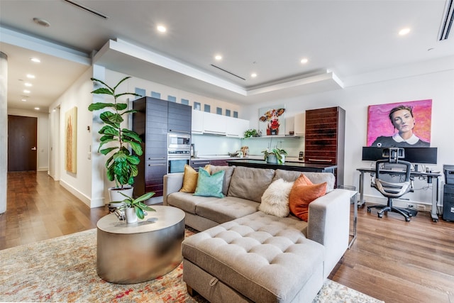 living room with light hardwood / wood-style floors