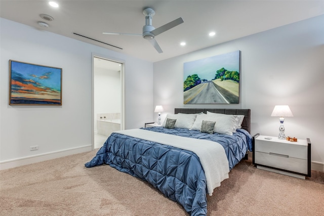 carpeted bedroom with ceiling fan and ensuite bathroom