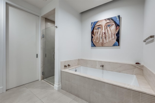 bathroom featuring tile patterned floors and plus walk in shower