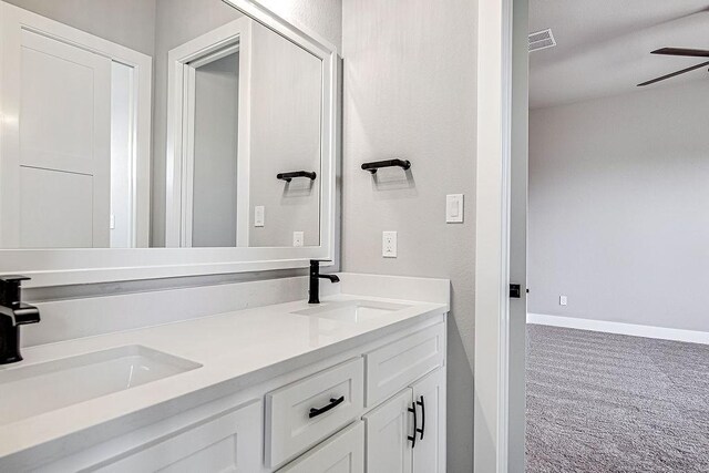 bathroom with ceiling fan and vanity