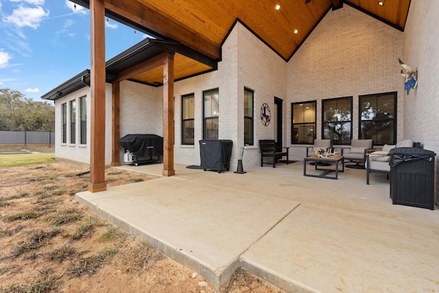 view of patio / terrace with an outdoor living space and a grill