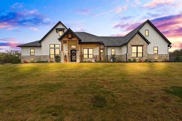 modern farmhouse style home featuring a yard