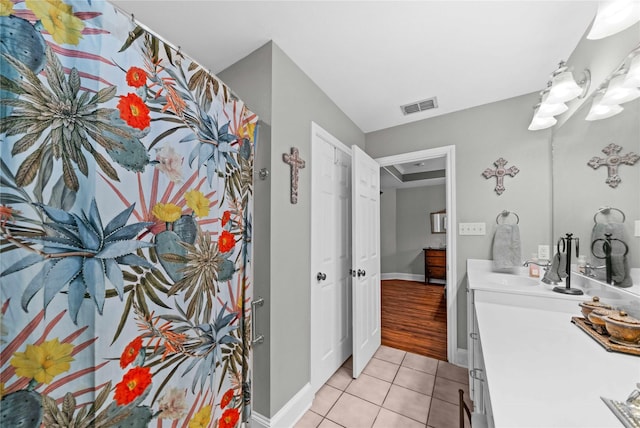 bathroom featuring tile patterned floors and vanity