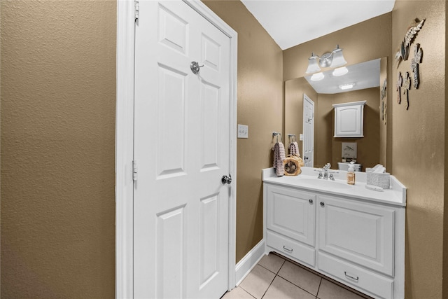 bathroom featuring tile patterned floors and vanity