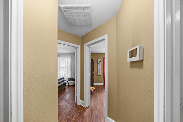 hallway featuring hardwood / wood-style flooring