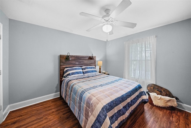 bedroom with dark wood-type flooring and ceiling fan