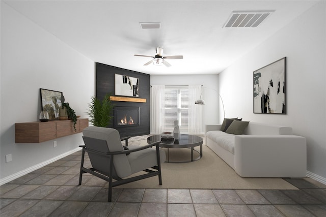 living room featuring ceiling fan and a large fireplace