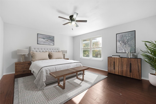 bedroom featuring ceiling fan and dark wood-type flooring