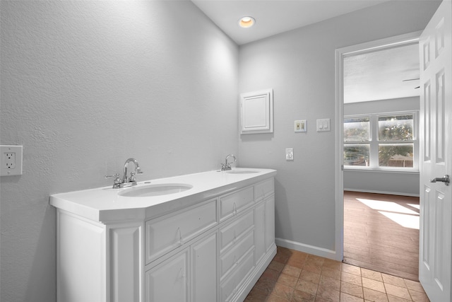 bathroom featuring wood-type flooring and vanity