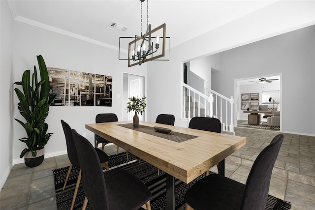 dining area with ceiling fan, a towering ceiling, and crown molding