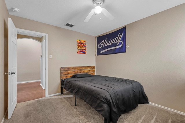 carpeted bedroom featuring ceiling fan