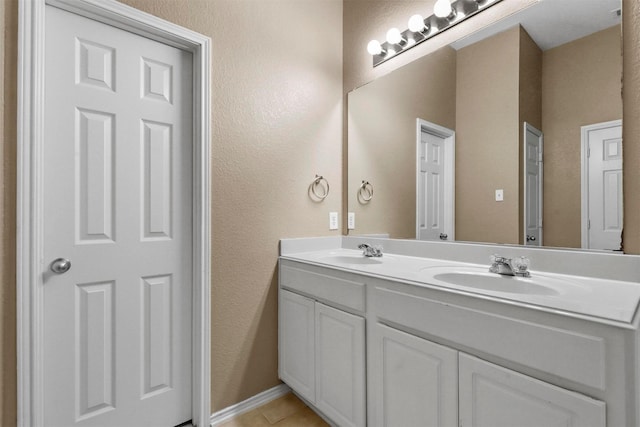 bathroom with tile patterned flooring and vanity