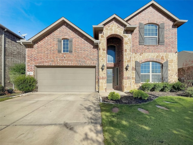 view of front property featuring a front yard and a garage