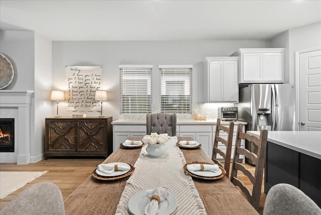 dining area with light hardwood / wood-style flooring