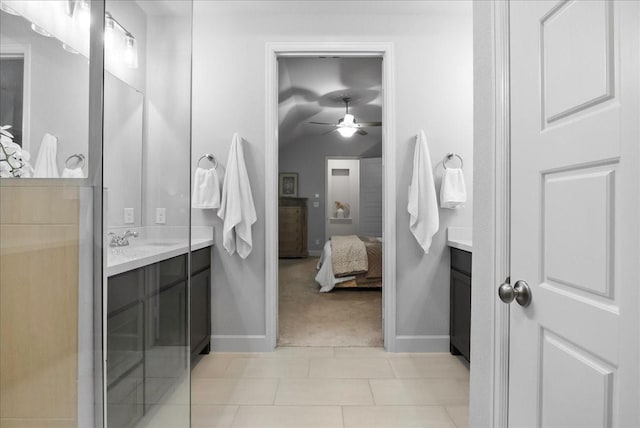 bathroom with tile patterned flooring, vanity, and ceiling fan