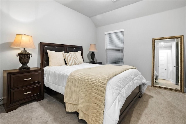 carpeted bedroom with vaulted ceiling