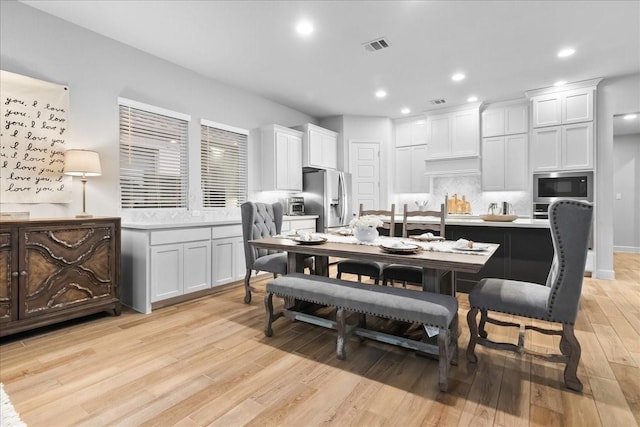 dining area with light wood-type flooring