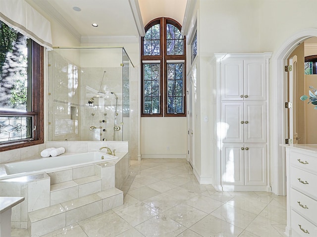 bathroom featuring ornamental molding and plus walk in shower