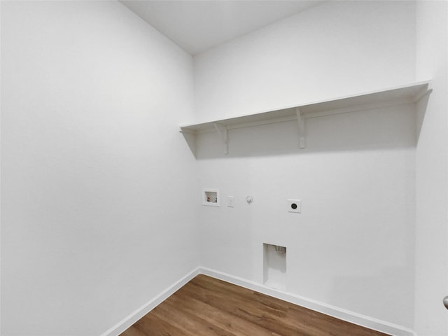 washroom featuring washer hookup, hookup for a gas dryer, dark wood-type flooring, and electric dryer hookup