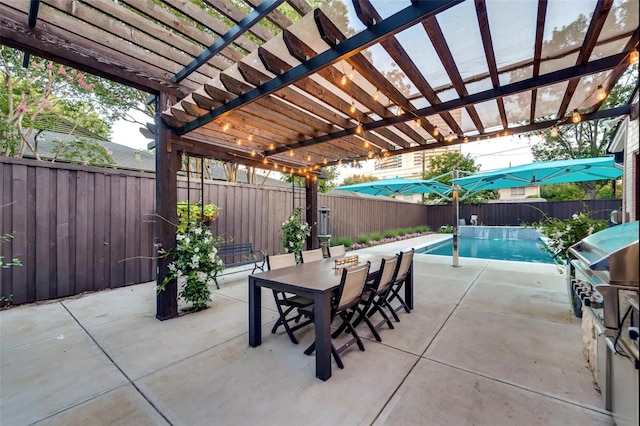 view of patio / terrace featuring a fenced in pool and a pergola