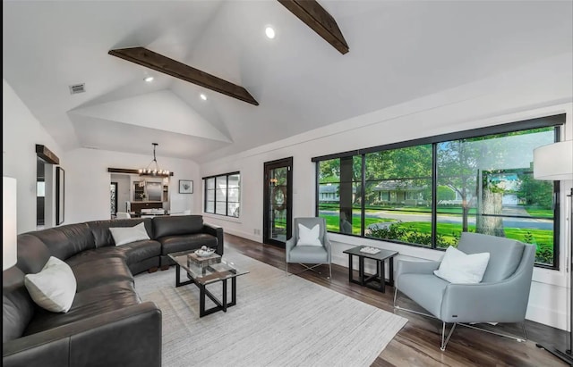 living room featuring beam ceiling, high vaulted ceiling, a chandelier, and hardwood / wood-style flooring