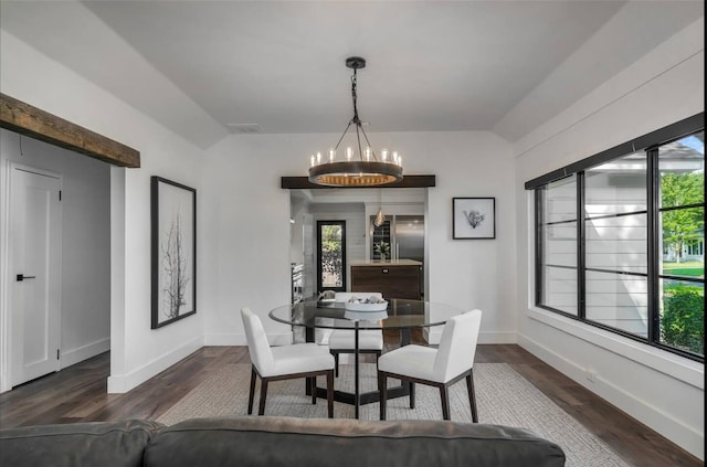 dining room featuring dark hardwood / wood-style flooring and an inviting chandelier