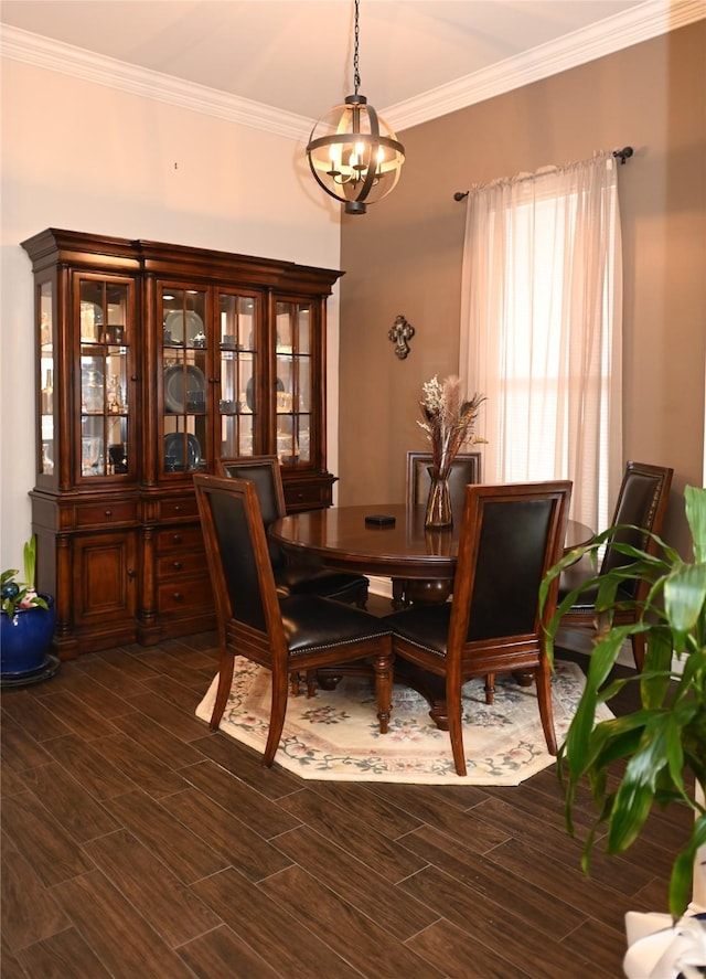 dining area featuring crown molding and a chandelier