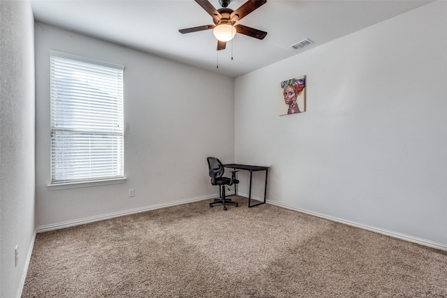 carpeted office with ceiling fan