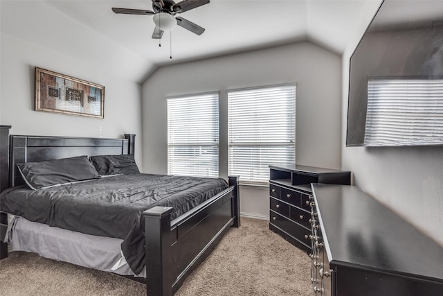 bedroom with light carpet, ceiling fan, and vaulted ceiling