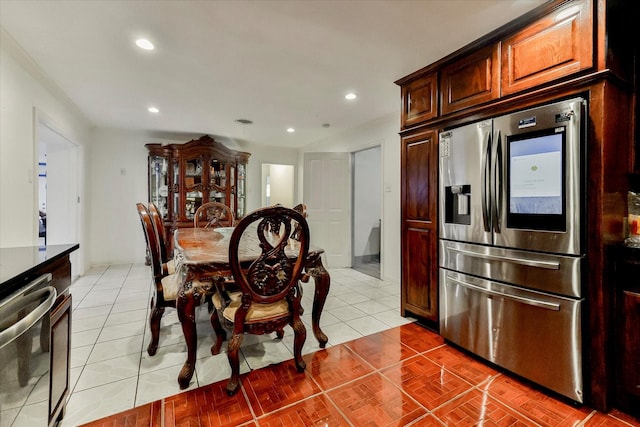 dining space featuring light tile patterned flooring