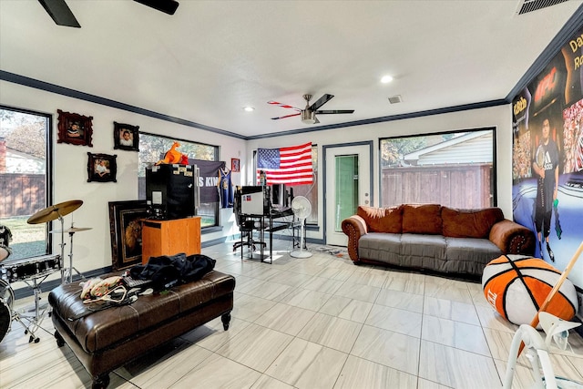 living room with ceiling fan and crown molding