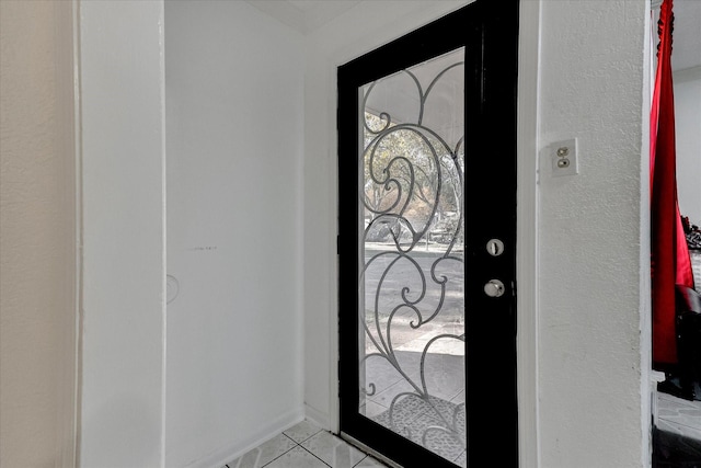 foyer featuring light tile patterned floors