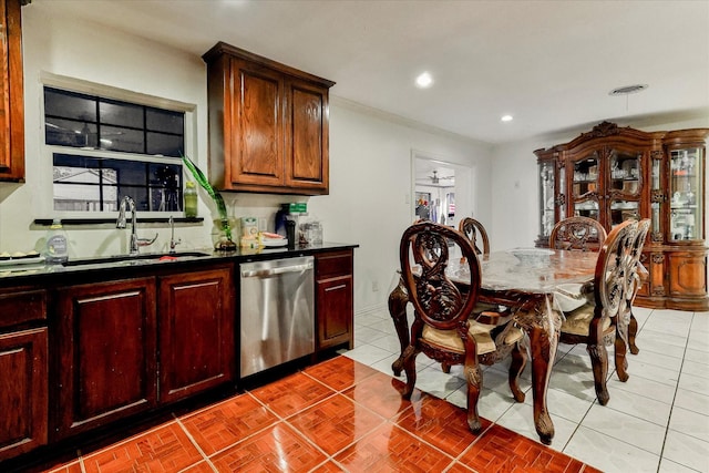 kitchen featuring stainless steel dishwasher, ceiling fan, light tile patterned floors, and sink