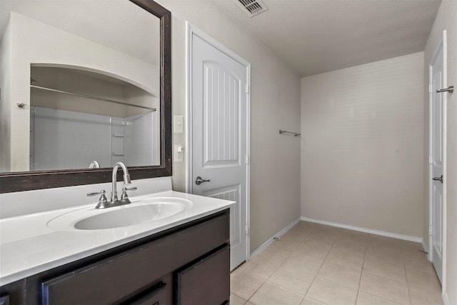 bathroom featuring tile patterned floors and vanity