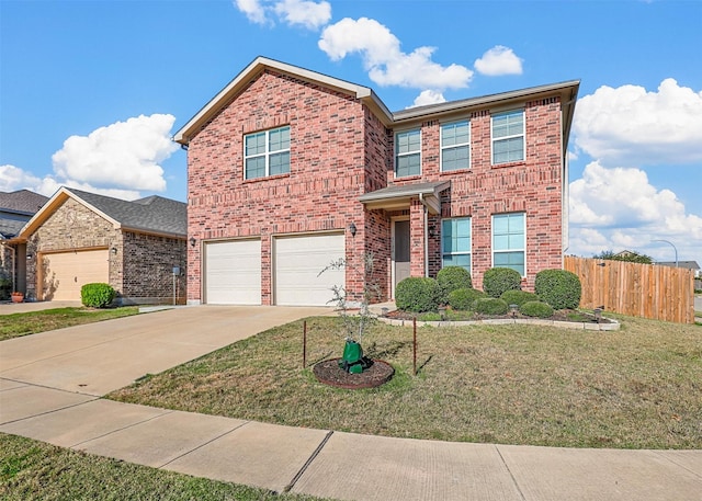 view of property with a front lawn and a garage