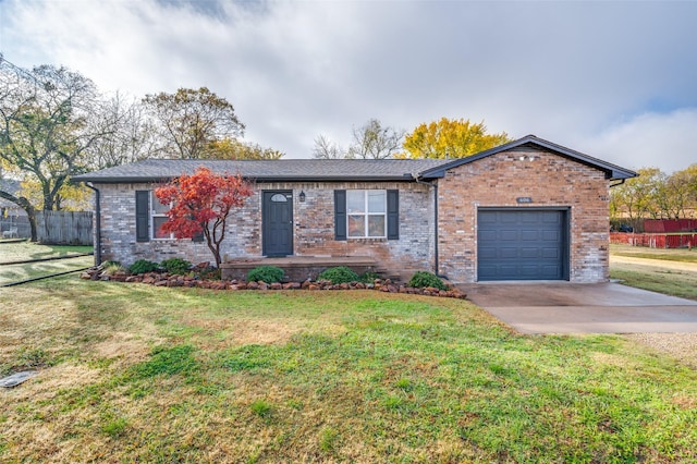 ranch-style home with a front yard and a garage