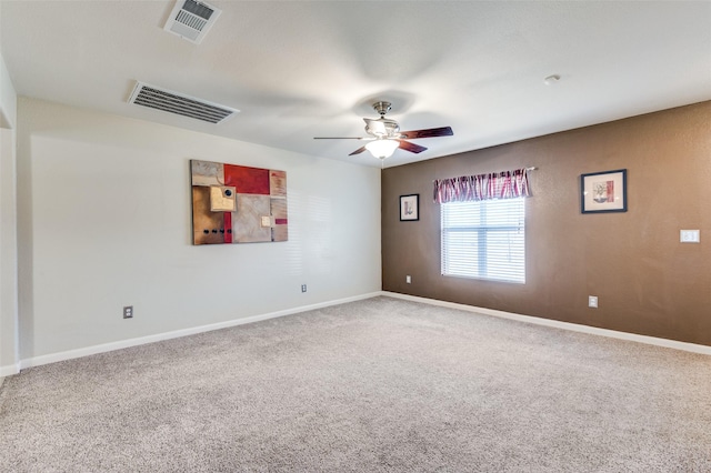 spare room with carpet flooring and ceiling fan