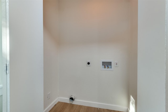 washroom featuring hookup for an electric dryer, wood-type flooring, and hookup for a washing machine